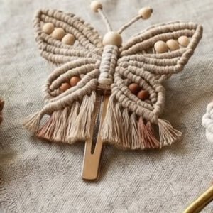 Finished boho butterfly hair clip macramé pattern with beaded body and ombré fringe