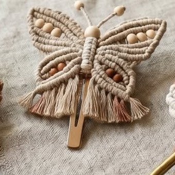 Finished boho butterfly hair clip macramé pattern with beaded body and ombré fringe