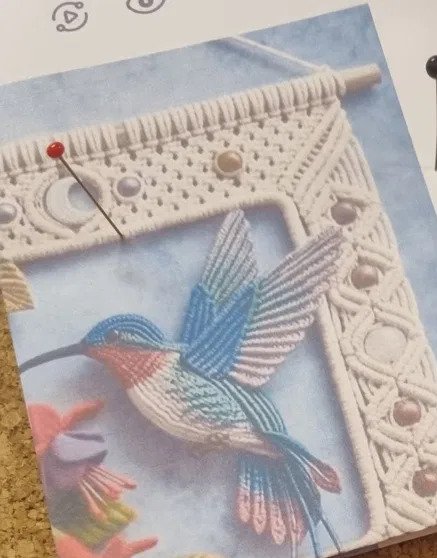 Delicate hummingbird macramé pattern in steel blue and dusty rose with picot-edge feathers