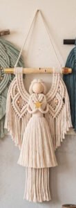 Completed ivory angel wall hanging macramé pattern with lattice wings and star charm
