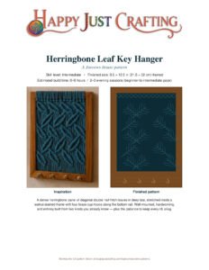 Finished herringbone leaf key hanger macramé pattern in teal inside walnut frame with brass hooks