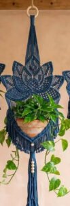 Finished indigo lotus plant hanger macramé pattern holding a terracotta pot