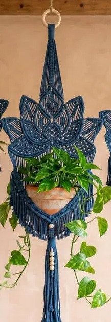 Finished indigo lotus plant hanger macramé pattern holding a terracotta pot