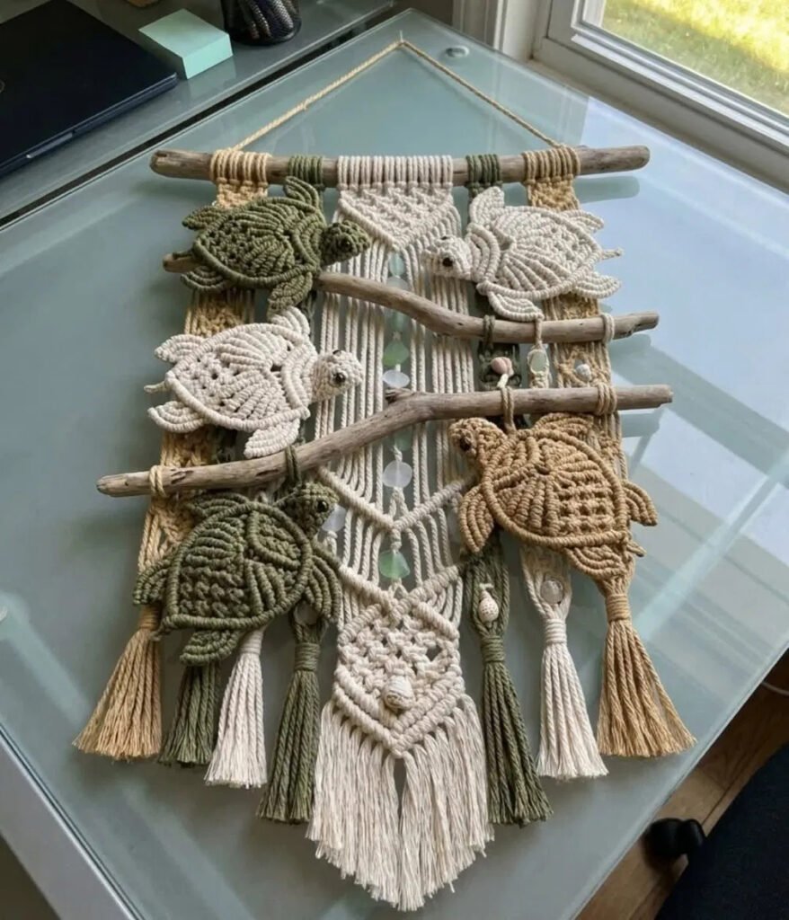 Five hand-knotted sea turtles gliding across a driftwood current in a sea turtle macramé wall hanging pattern